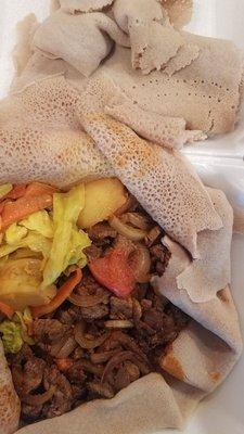 Awaze Tibs with local injera & cabbage and potatoes