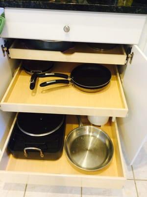 Top shelf is for lids with two more shelves for the pots and pans.