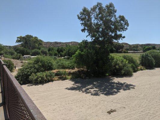 Aztec Village, left, and horse pasture, right, from the pedestrian overpass.