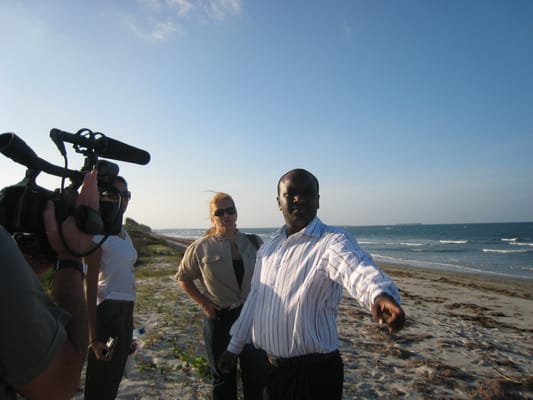 Entrepreneur Damasi Mfugale shows students the site of their new hotel.  Dar es Salaam, Tanzania