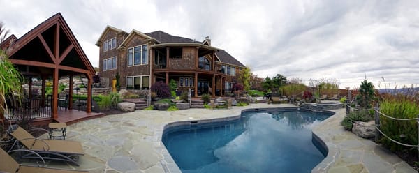 This project included rock speakers hidden by the pool, recessed speakers under the patio, & an outdoor TV entertainment system!