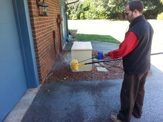 Step 2 Use broom duster around eaves and lighting for long-term spider web control