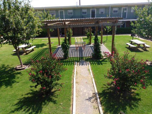 Courtyard with picnic tables and BBQ grills for your enjoyment.