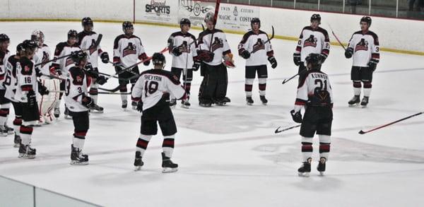 Magicians players salute the crowd following a win.