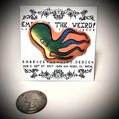 A handmade Inky lapel pin