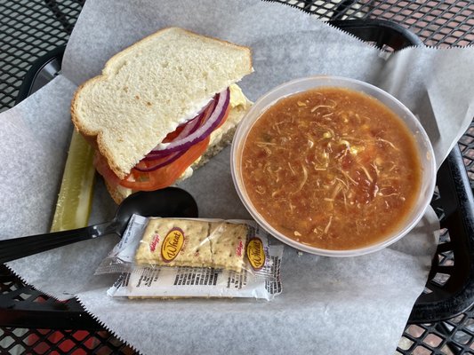 1/2 egg sandwich on sourdough with cup of Brunswick stew