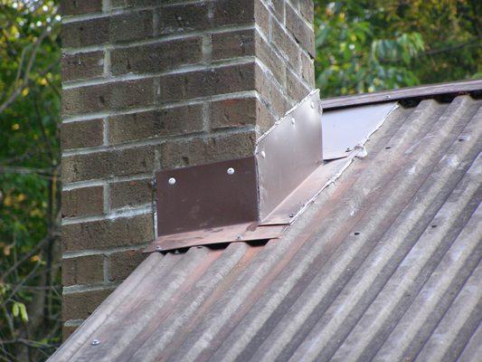 Chimney flashing repair to exclude bats from entering the roof space.