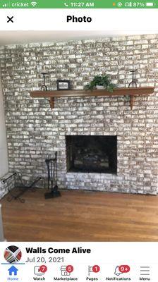 With washed red brick fireplace