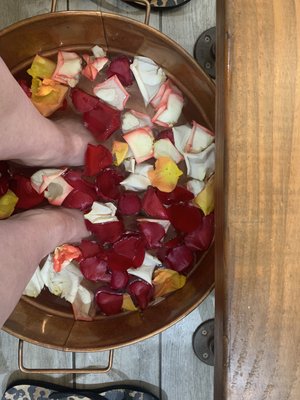 Pedi soak with rose petals for the bday girl.