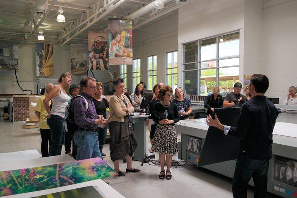 Local artists touring our print shop.