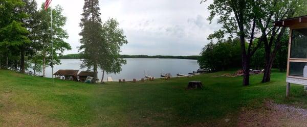 This is a view of the lake during the day. There is a boardwalk with lots of docks and a sand pit for the kids.