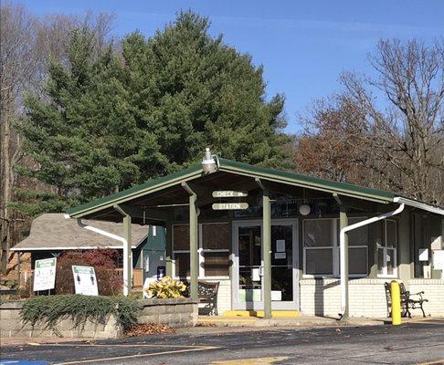 Camp sign-in building with large parking lot.