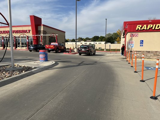 Drive thru I entered with log chain  hanging low matching driveway color