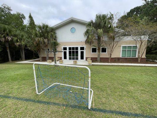 a soccer field behind the church