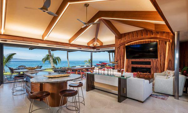 Pocketing glass door walls open Maui remodeled space to oceanfront