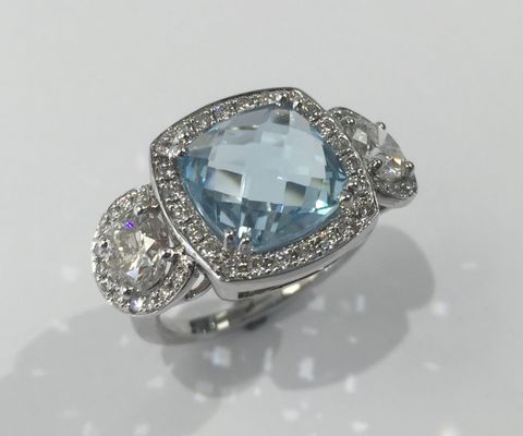 Blue Topaz and Diamond Halo Ring in 18k White Gold