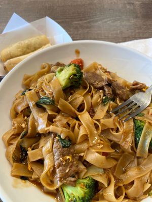 Spicy drunken noodles and egg rolls