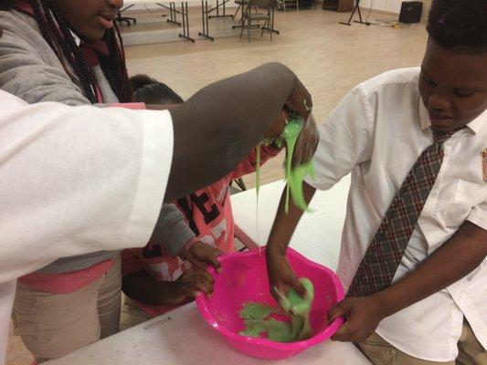 Learning is often a hands-on experience, such as in this polymer making activity.