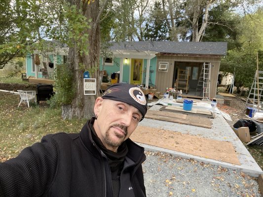 Selfie of the new garage and driveway  After the concrete pour and after I lifted and leveled the carport roof