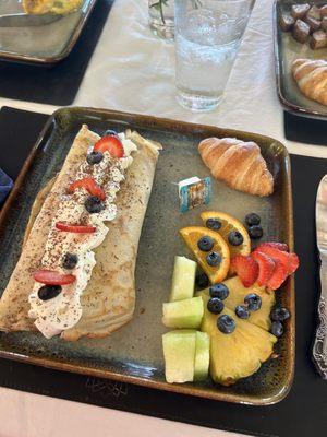 Fruit crepe, fruit, and croissant