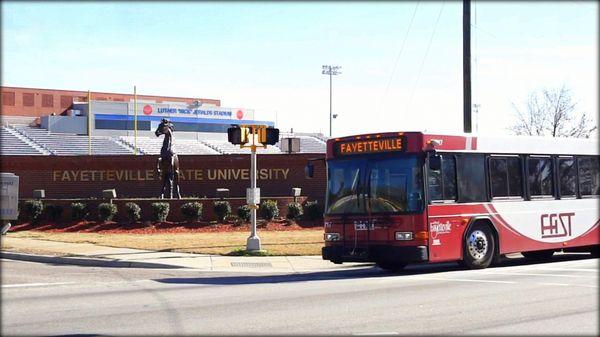 FAST city bus passing Fayetteville State University 6 miles away from O2 Dental Group of Fayetteville