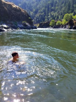 Swim in the Rogue River.  Clean, pristine, and cool.