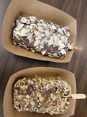 Paletas with chocolate and nut toppings.