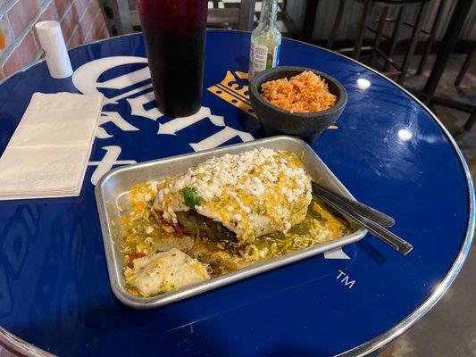 Chicken chilango burrito with green sauce and side of rice.