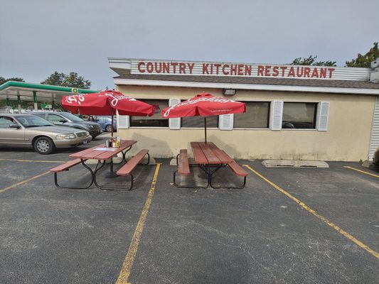 Couple picnic tables with table service.