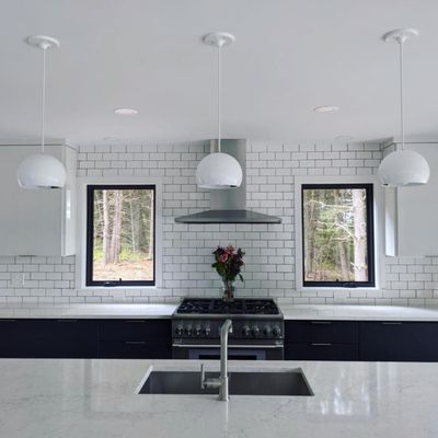 Modern kitchen with hand laid subway tiles