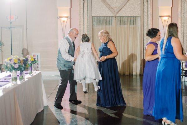 Flower girl having a good time. Between the two they manage to catch some of the best candid pictures!
 Photo Credit Nicole Gatto