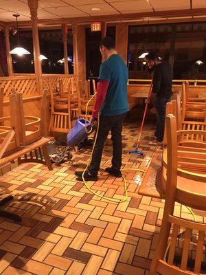 Washing the floor at the pizza place