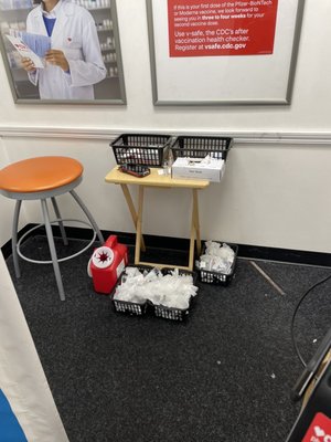 Unattended covid vaccines and used needles - with absolutely no one around.