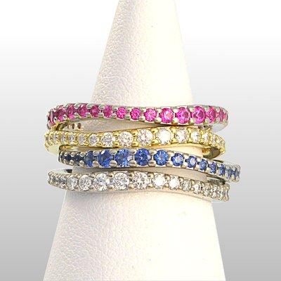 Tomas Fistler: White gold Wave rings, Pink, Blue , Yellow sapphires and white diamond bands ranging from 1mm to 2.5mm stones.