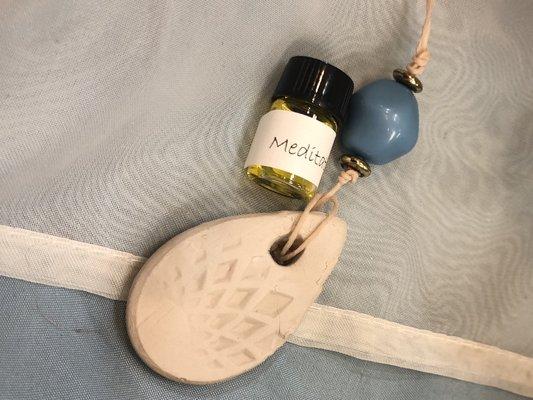 Handmade diffuser necklace with free sample of aromatherapy oil.