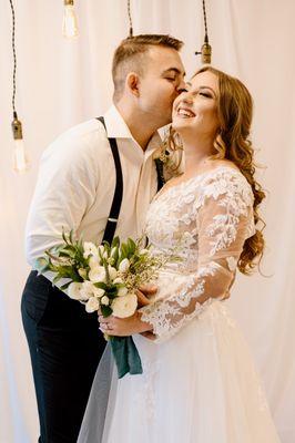 Industrial chic bride and groom in downtown Tampa Fl. Petite bouquets and Edison bulbs for the win!