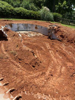 Pool demolition in progress