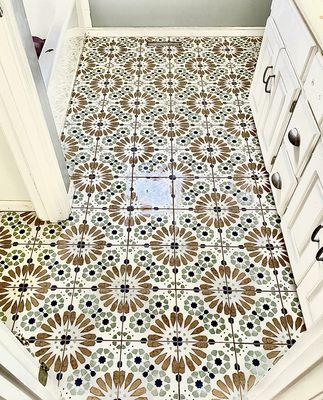 Unique floor tile in bathroom.