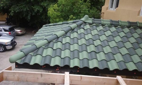 A VIEW OF THE HIPS OF THE TILE ROOF