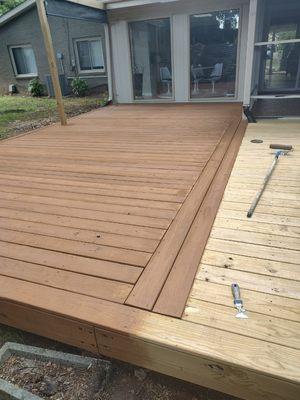 Staining a deck, improved appearance and protection from weather