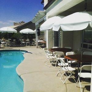 Pool party with tables, chairs and umbrellas