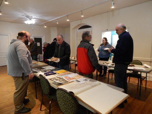 Visitors at a behind-the-scenes collections showcase.