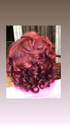 Vibrant red violet color on pre-bleached hair.