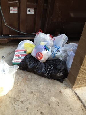 Piles of trash outside the compactor. Lazy people!