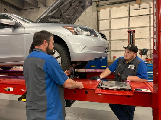 Technician training on new Hunter alignment machine.