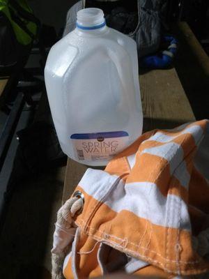 Gym bag and gallon of water.