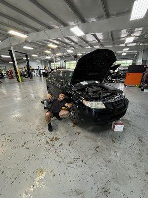 The shop of Thomas Tire with an associate from High School (we haven't been in contact for months)