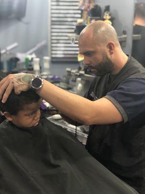 I've brought both my boys here for almost a year and half and Ricky is one of the best barbers I have ever met the kids love him.