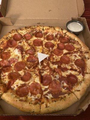 Large stuffed crust pepperoni pizza with a side of Ranch