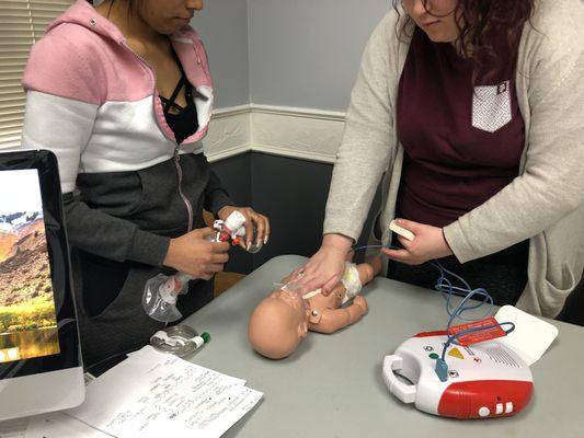 Students practicing the use of AED